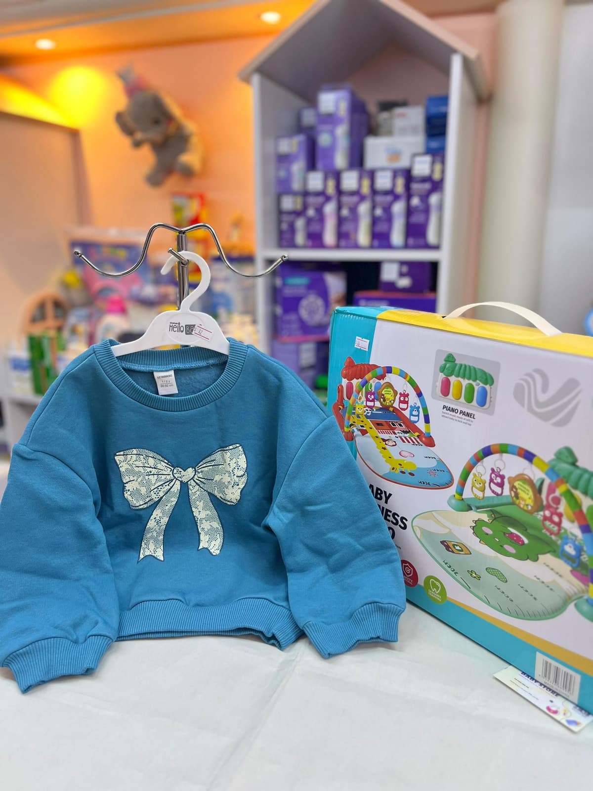 كنزة تركواز ببيونة بالنص 18-24شهر